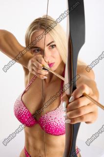 Mona Sitting with Bow Aim